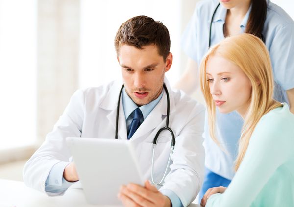 healthcare, medical and technology - doctor showing something pa