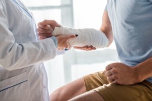 A man in Hamilton with an arm injury during physical examination and will look for a lawyer to represent his case.