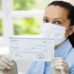 Woman-In-Face-Mask-Holding-Paycheck-