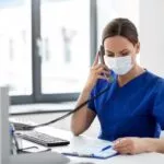 female healthcare worker wearing medical mask