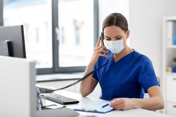female healthcare worker wearing medical mask
