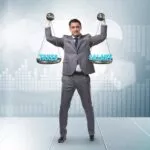 Businessman holding scales trying to find balance